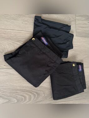 2 French Connection Kids Black School pants and black leggings.